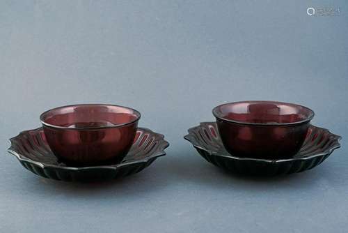 A BEAUTIFUL PAIR OF PEKIN GLASS CUPS AND SAUCERS