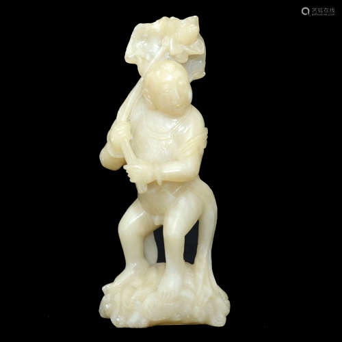 A SOAPSTONE CARVING OF A BOY HOLDING A LOTUS FLOWER