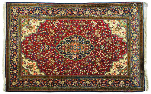 AN OLD PERSIAN QOM RUG