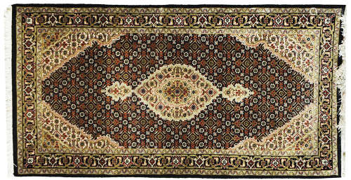 A PERSIAN TABRIZ RUG