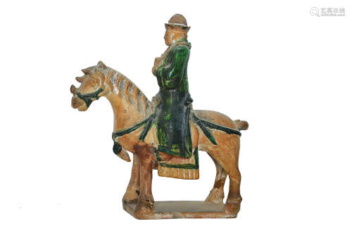 A MING SANCAI POTTERY HORSE AND EQUESTRIAN