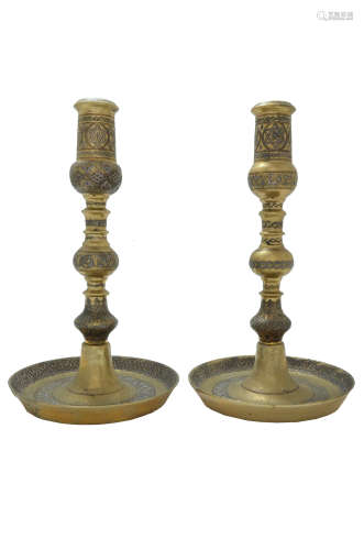 A PAIR OF MASSIVE SILVER AND COPPER INLAID BRASS CANDLESTICKS