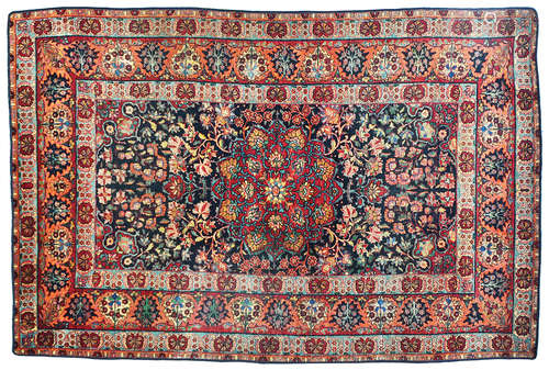 AN OLD PERSIAM KERMAN RUG