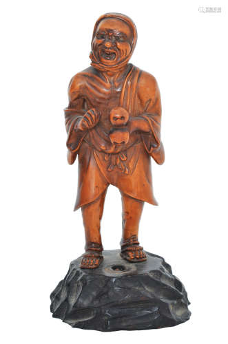 A JAPANESE CARVED BOXWOOD FIGURE