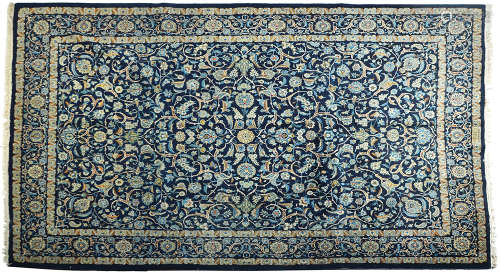 AN OLD PERSIAN QOM RUG