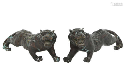 A PAIR OF CHINESE CAST BRONZE TIGERS