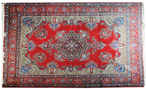 A PERSIAN KASHAN RUG