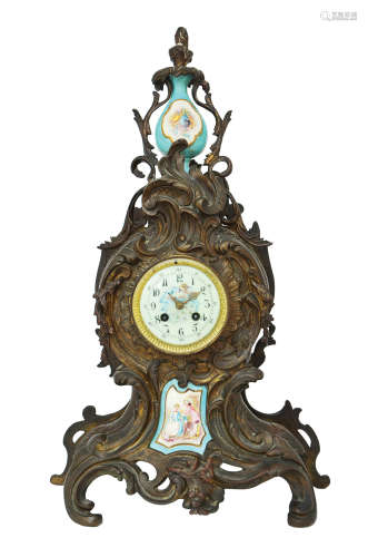 A FRENCH PEWTER AND PORCELAIN CLOCK
