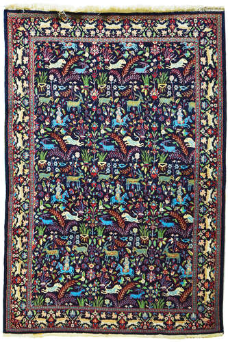 AN OLD INDIAN WOOL AND SILK RUG