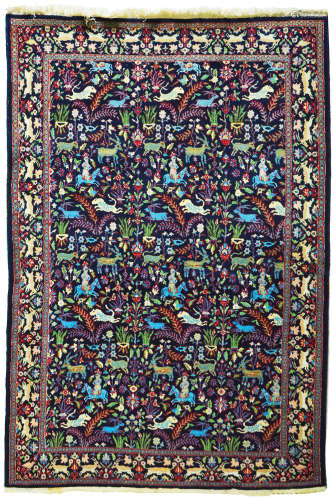 AN OLD INDIAN WOOL AND SILK RUG