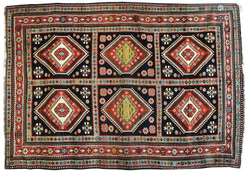 AN AOLD CAUCASIAN RUG