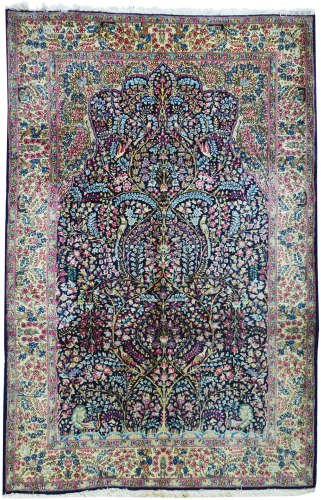 AN OLD PERSIAN KERMAN RUG