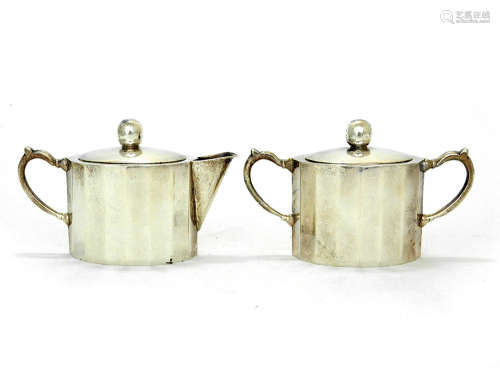 A STERLING SILVER CREAMER AND SUGAR BOWL