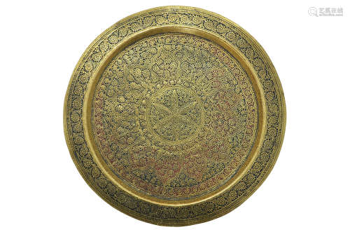 A RED AND BLACK ENAMEL FILLED BRASS PLATE