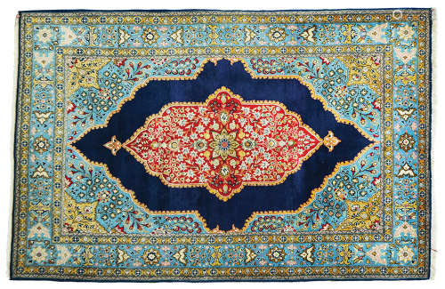 AN OLD PERSIAN QOM RUG