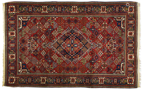 A PERSIAN KASHAN RUG