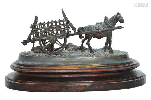 A SPELTER FIGURE OF A HORSE LED CART