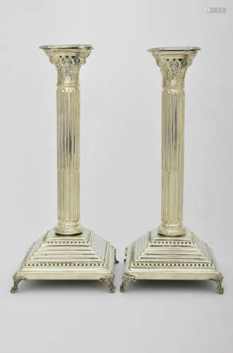A PAIR OF STERLING SILVER CANDLESTICKS