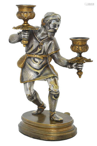 A SILVERED AND PARCEL-GILT BRONZE FIGURE OF THE BIRDCATCHER
