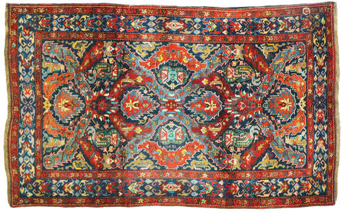 AN ANTIQUE CAUCASIAN RUG