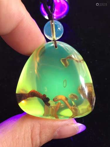 A AMBER PENDANT FROM MYANMAR