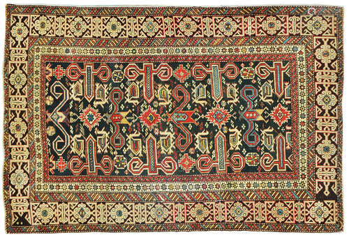 AN ANTIQUE CAUCASIAN RUG