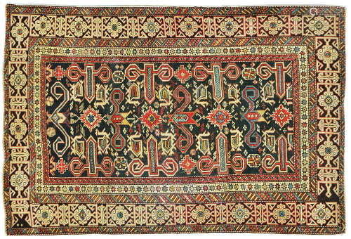 AN ANTIQUE CAUCASIAN RUG