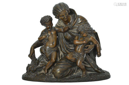 A BRONZE GROUP FIGURE OF A MOTHER FEEDING HER TWO BOYS GRAPES