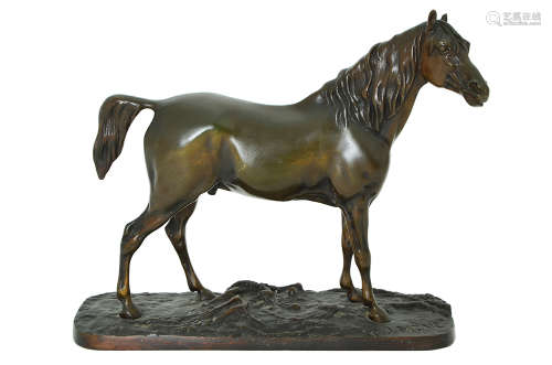 A BRONZE MODEL OF A HORSE