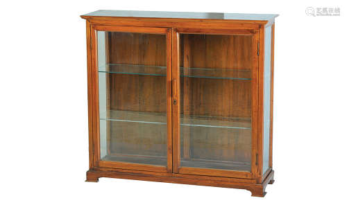 A WALNUT AND GLASS DISPLAY CABINET