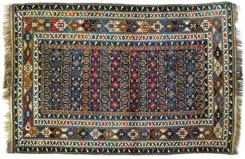 AN ANTIQUE CAUCASIAN AKSTAFA RUG