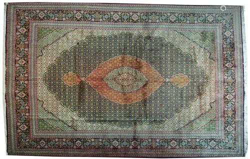 A PERSIAN TABRIZ SILK THREAD RUG