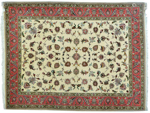 A PERSIAN TABRIZ RUG