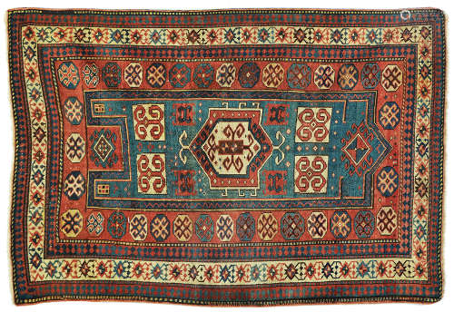 AN ANTIQUE CAUCASIAN KAZAK RUG