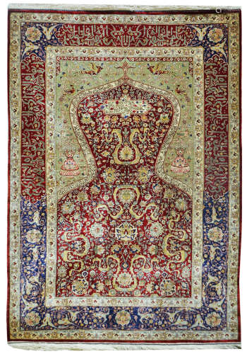 A TURKISH HEREKEH SILK AND GOLD THREAD RUG