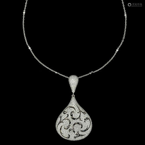 A MASSIVE 18K WHITE GOLD PENDANT