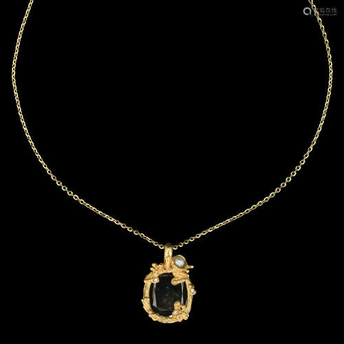 AN 18K GOLD PENDANT