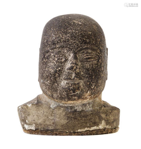 A Carved Stone Head of Buddha