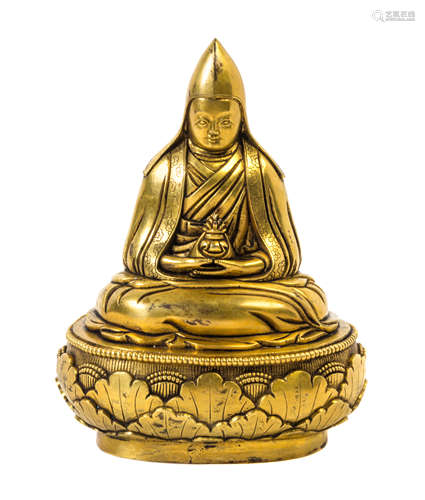 A Sino-Tibetan Gilt Bonze Figure of a Lama