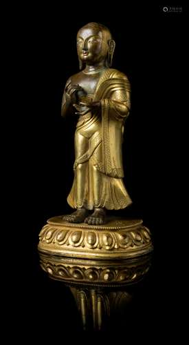 A Sino-Tibetan Gilt Bronze Figure of a Standing Buddhist Monk