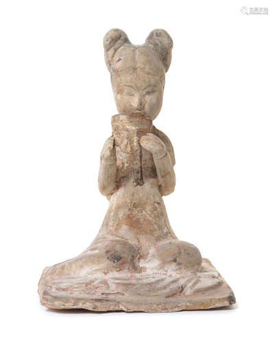 A Pottery Figure of a Female Musician