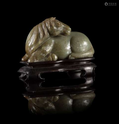 A Carved Celadon Jade Figure of a Recumbent Horse