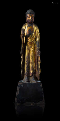 A Gilt Lacquered Wood Figure of Standing Buddha