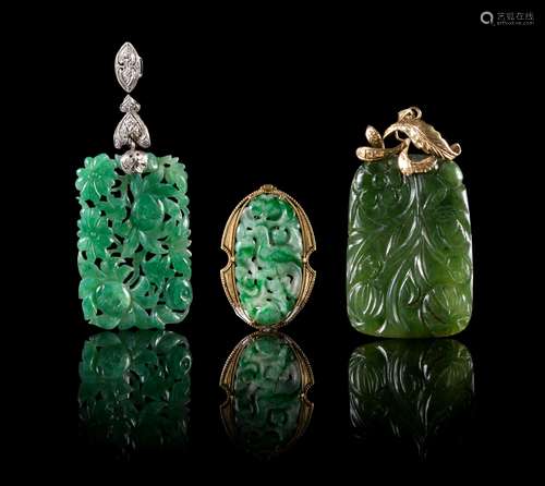 Three Jade and Jadeite Pendants Length of largest 2 1/4 inches.