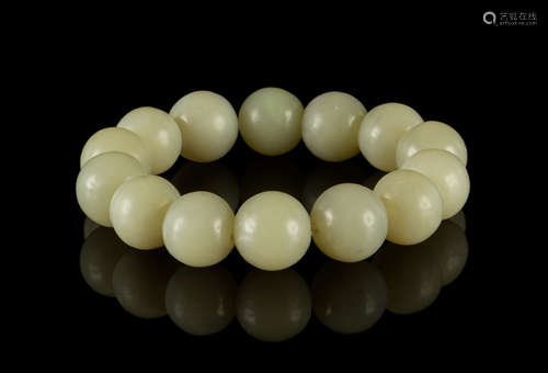 A Celadon Jade Bead Strand