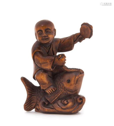 A Carved Wood Netsuke