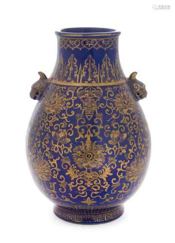 A Gilt Decorated Powder Blue Glazed Porcelain Zun Vase Height 9 3/4 inches.