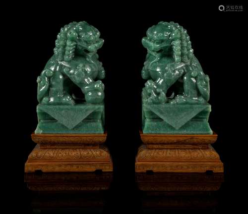 A Pair of Green Jade Figures of Fu Lions