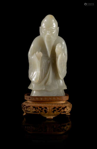 A Near-White Jade Figure of Standing Shoulao