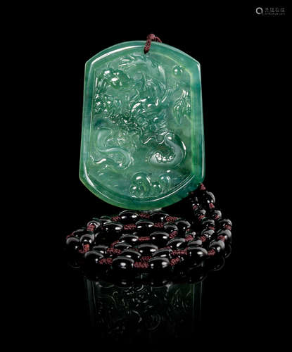 A Carved Jadeite Pendant